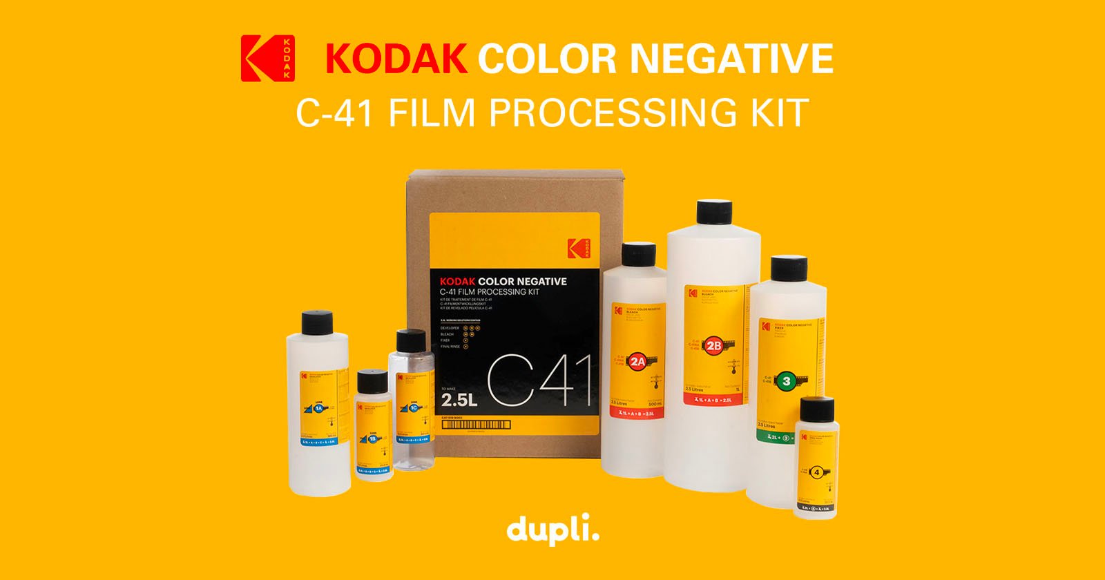 The image shows a Kodak Color Negative C-41 film processing kit, including multiple bottles of chemicals in varying sizes, all against a yellow background. Text on the image reads Kodak Color Negative C-41 Film Processing Kit along with the dupli. logo at the bottom. The image shows a Kodak Color Negative C-41 film processing kit, including multiple bottles of chemicals in varying sizes, all against a yellow background. Text on the image reads Kodak Color Negative C-41 Film Processing Kit along with the dupli. logo at the bottom.