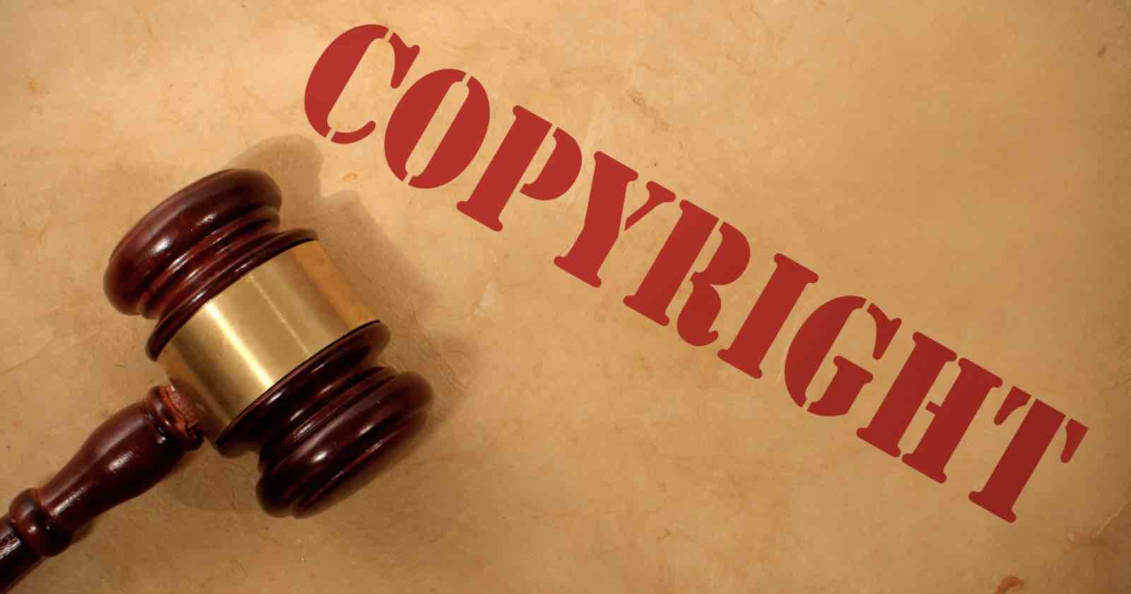 A judge’s gavel rests on a brown surface, with the word COPYRIGHT in large red letters diagonally across the image. A judge’s gavel rests on a brown surface, with the word COPYRIGHT in large red letters diagonally across the image.