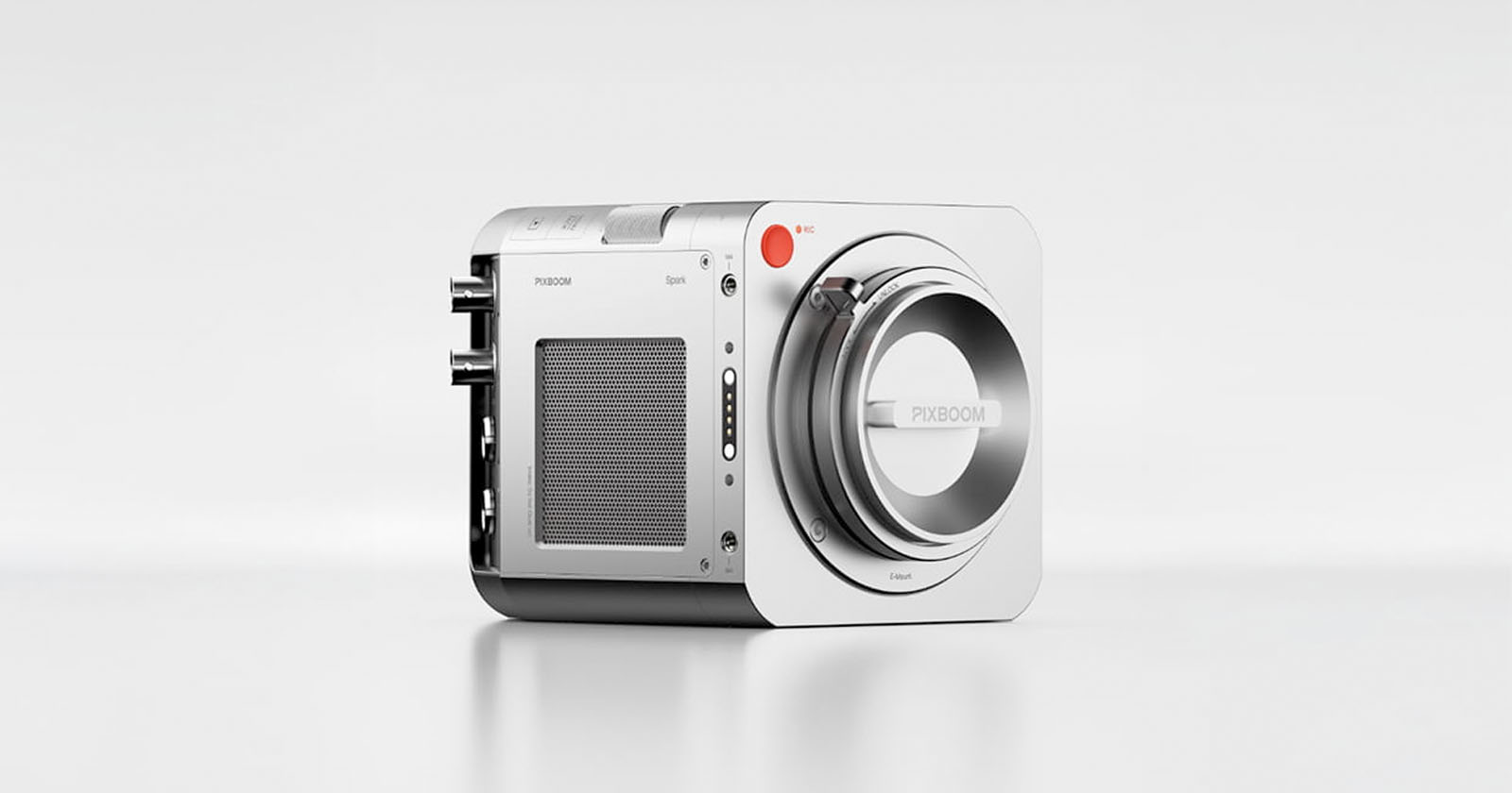 A modern, compact digital camera with a sleek, square design, silver body, and prominent lens mount. The camera features a red record button and minimalistic controls against a plain white background. A modern, compact digital camera with a sleek, square design, silver body, and prominent lens mount. The camera features a red record button and minimalistic controls against a plain white background.